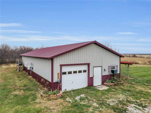 garage with cooling unit and a yard