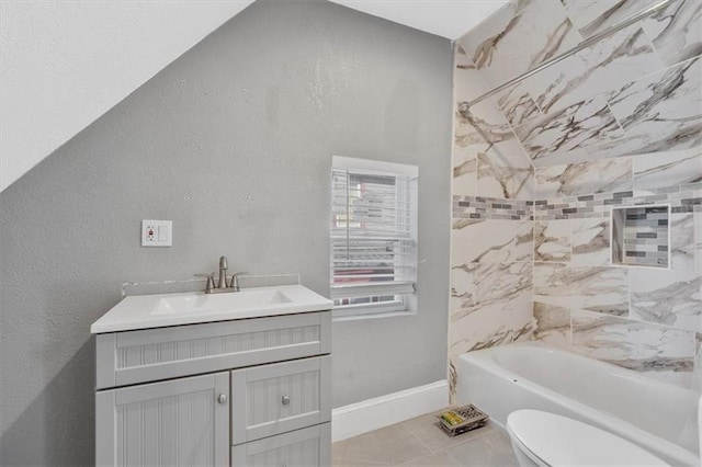 full bathroom with toilet, vanity, tile patterned floors, and tiled shower / bath