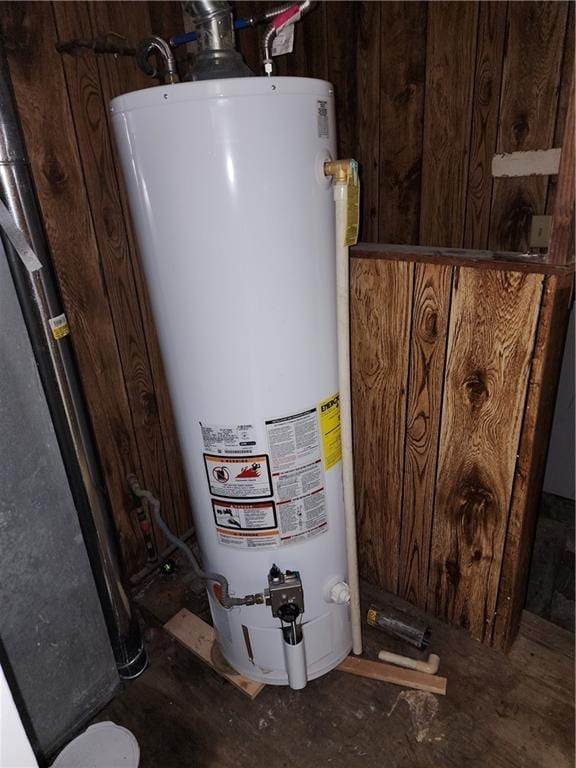 utility room featuring gas water heater