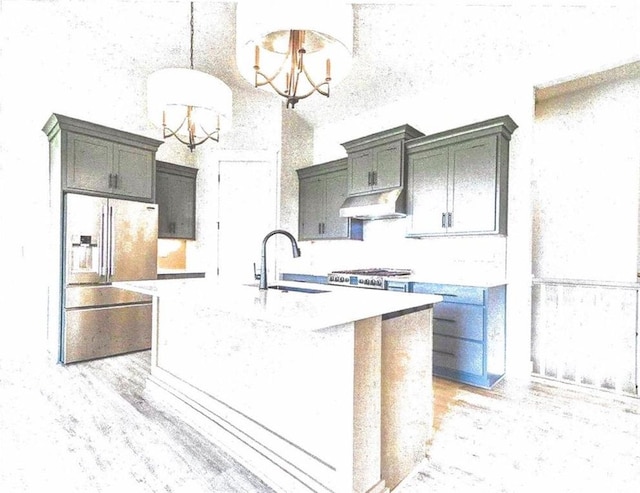 kitchen featuring exhaust hood, sink, a chandelier, hanging light fixtures, and an island with sink