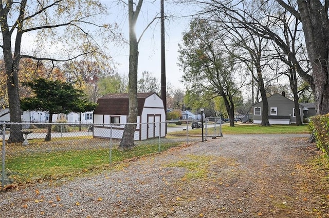 view of street with gravel driveway