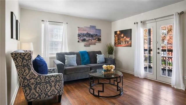 living room featuring french doors and dark hardwood / wood-style floors