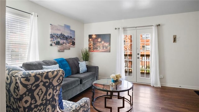 living room with dark hardwood / wood-style flooring