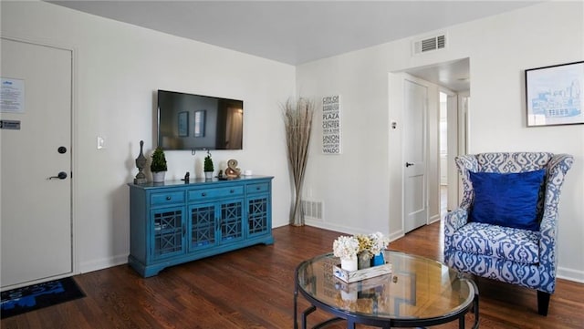 living room with dark hardwood / wood-style floors