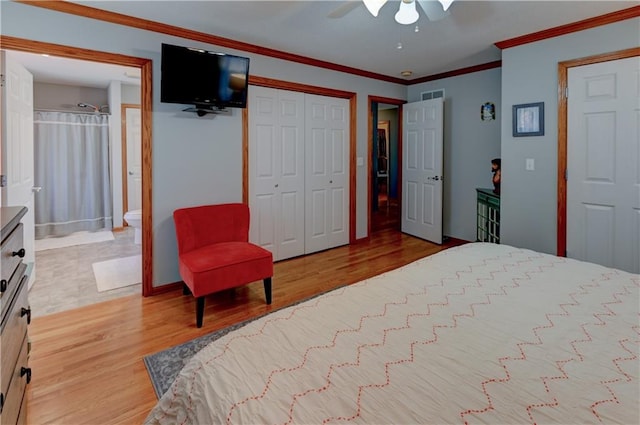 bedroom with connected bathroom, ceiling fan, light hardwood / wood-style flooring, and ornamental molding