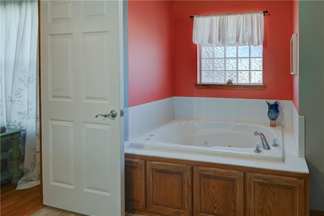 bathroom featuring a tub and hardwood / wood-style flooring