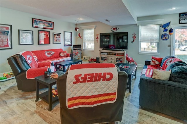 living room with light hardwood / wood-style flooring