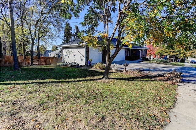 exterior space with a yard and a garage