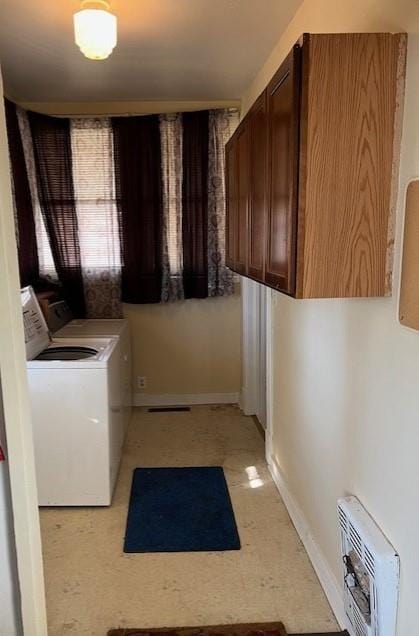 laundry room with cabinets and separate washer and dryer