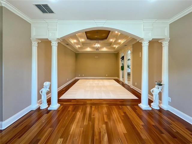 interior space with a chandelier, dark hardwood / wood-style floors, and ornamental molding