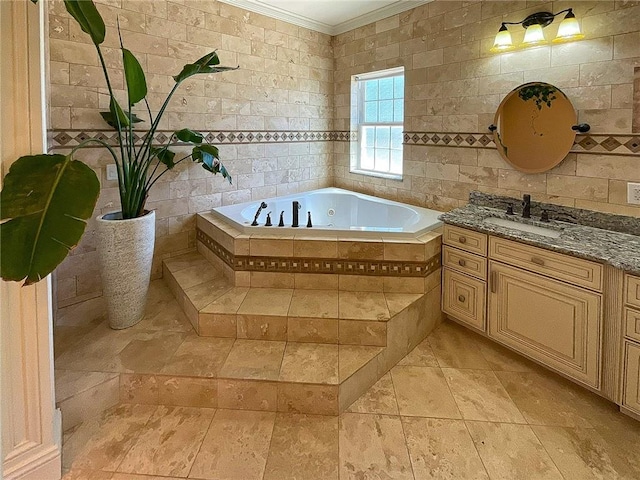 bathroom featuring tiled bath, vanity, tile walls, and ornamental molding