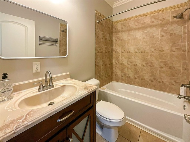 full bathroom featuring tile patterned flooring, vanity, toilet, and tiled shower / bath