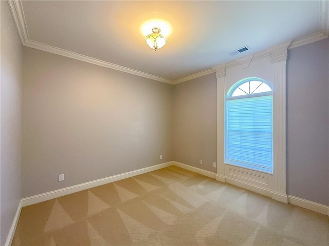 carpeted spare room with crown molding