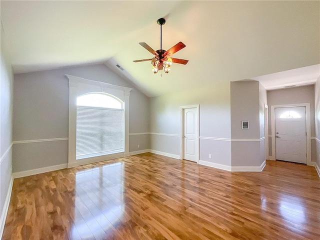 interior space featuring ceiling fan, light hardwood / wood-style flooring, and vaulted ceiling