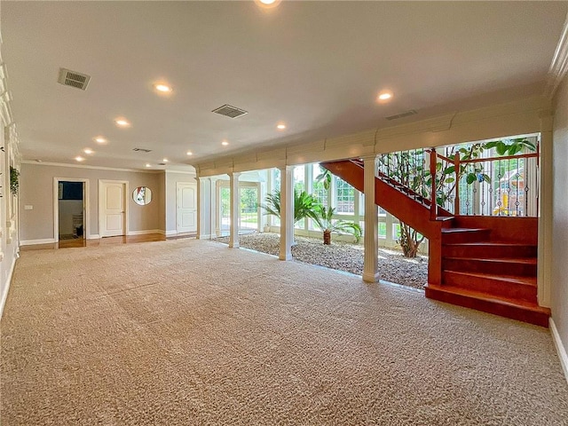 unfurnished living room featuring carpet flooring and ornamental molding