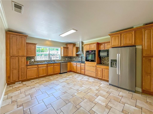 kitchen with wall chimney range hood, backsplash, crown molding, and black appliances