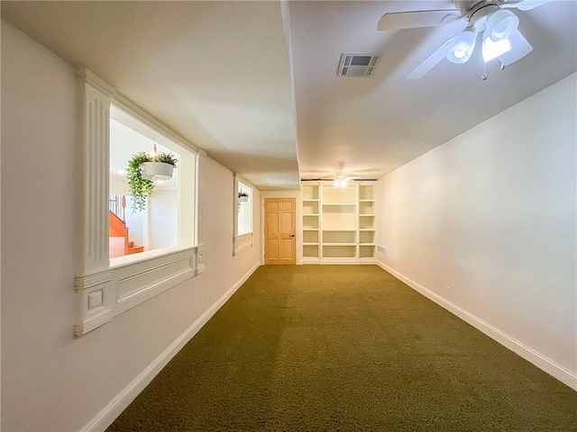 interior space with carpet flooring and built in shelves