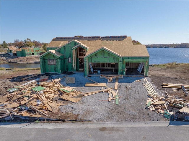 property in mid-construction featuring a water view