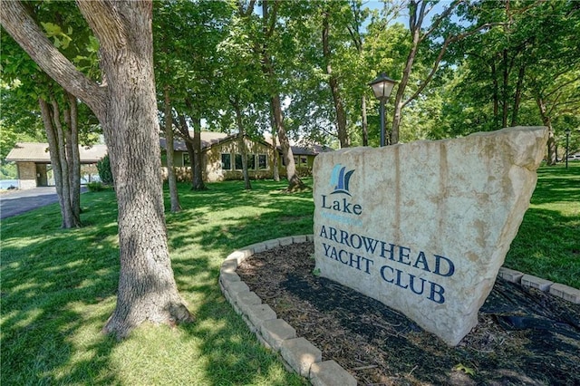 16 Checotah Bluffs Cir, Lake Winnebago, MO 64034 - community / neighborhood sign with a yard