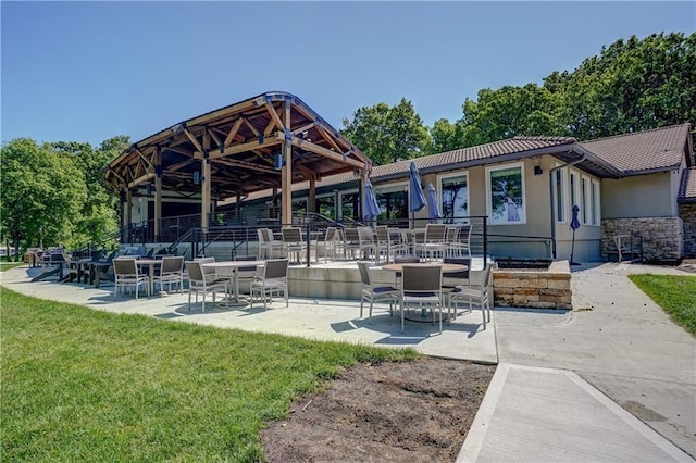 16 Checotah Bluffs Cir, Lake Winnebago, MO 64034 - view of property's community featuring a yard and a patio