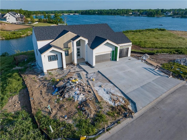 16 Checotah Bluffs Cir, Lake Winnebago, MO 64034 - aerial view of property and surrounding area with a nearby body of water