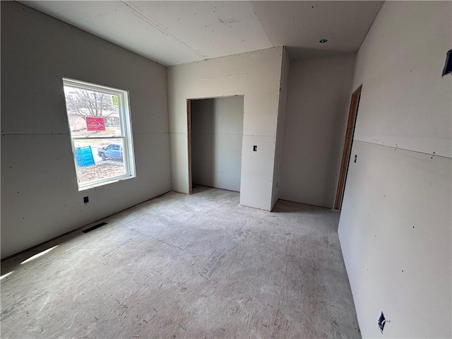 unfurnished bedroom with visible vents