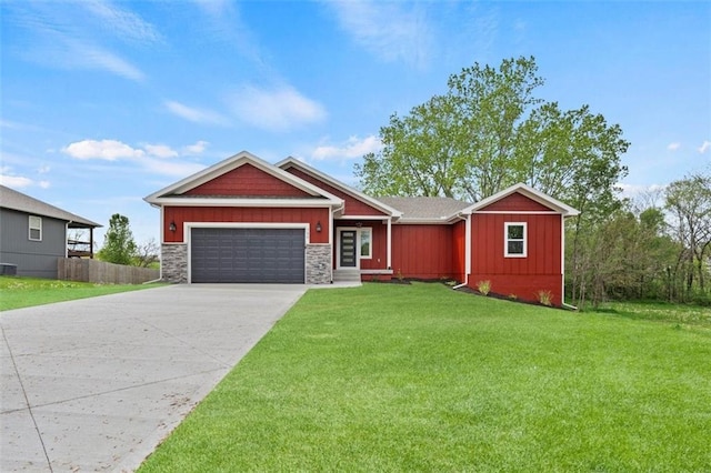 view of front of home featuring fence, a front lawn, concrete driveway, board and batten siding, and a garage