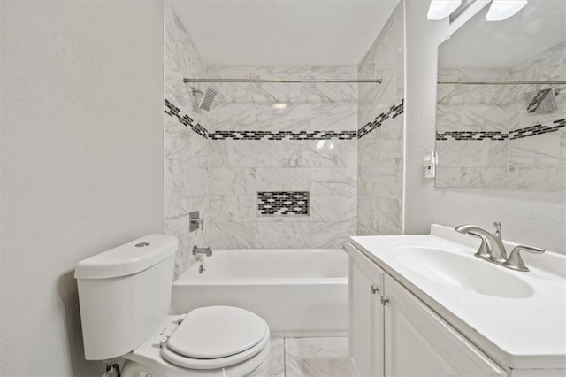 full bathroom featuring vanity, toilet, and tiled shower / bath combo