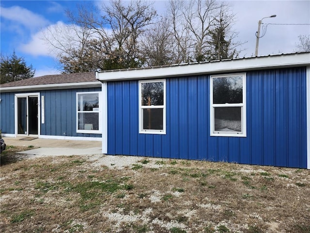 view of side of property featuring a patio