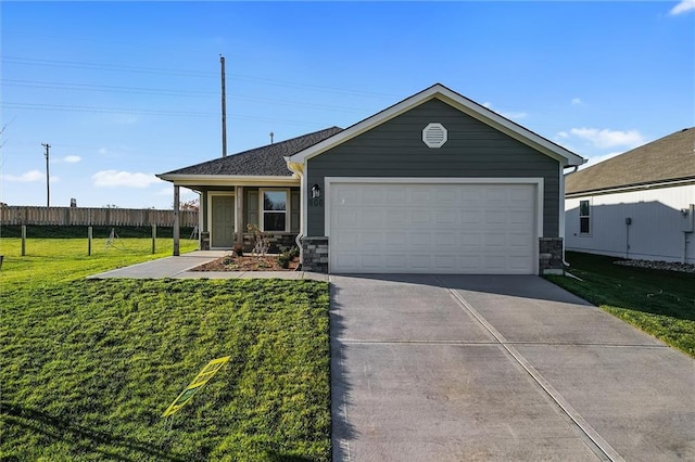 view of front of home with a front yard and a garage