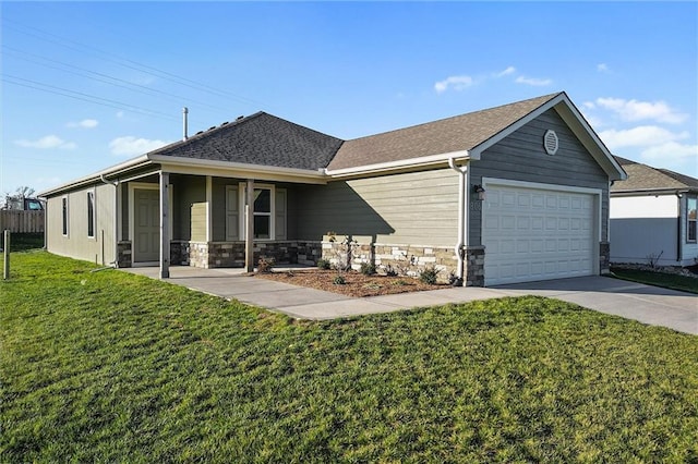 view of front of home with a garage and a front yard