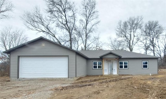 ranch-style house featuring a garage