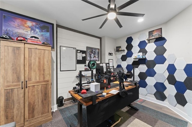 home office featuring dark hardwood / wood-style floors and ceiling fan