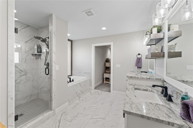 bathroom featuring vanity and separate shower and tub