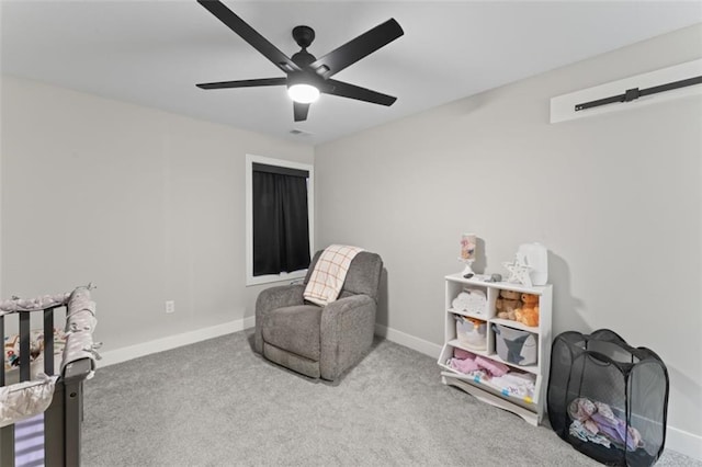 living area featuring ceiling fan and carpet floors