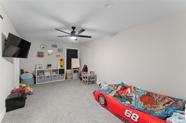 game room with carpet and ceiling fan