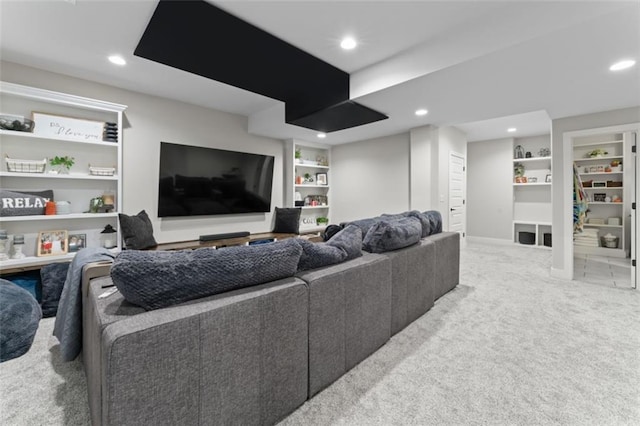 living room with light colored carpet and built in features