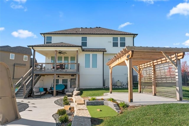 rear view of property with a yard, a pergola, ceiling fan, and a patio area