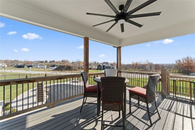 wooden deck featuring ceiling fan