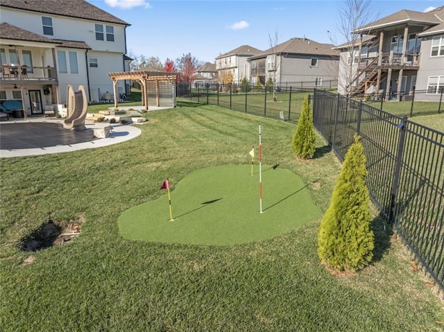 view of community featuring a yard, a pergola, and a patio