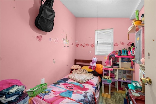 bedroom featuring wood-type flooring and lofted ceiling