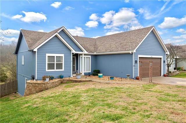 view of front of home featuring a front lawn and a garage