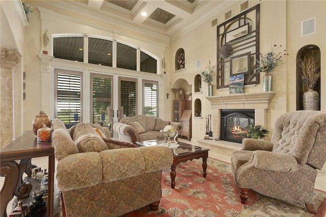 living room with beamed ceiling, ornamental molding, a high ceiling, and coffered ceiling