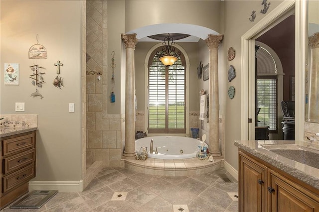 bathroom with decorative columns, a wealth of natural light, vanity, and independent shower and bath