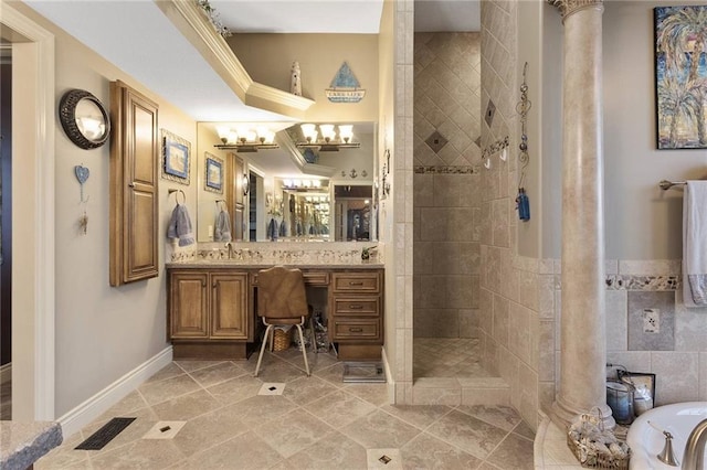 bathroom with tile patterned flooring, shower with separate bathtub, vanity, and ornate columns