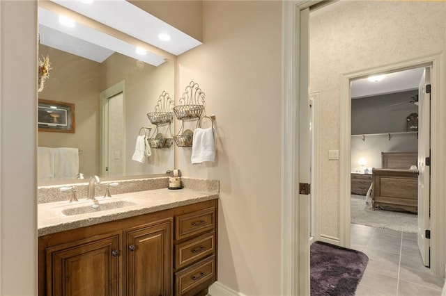 bathroom with tile patterned floors and vanity