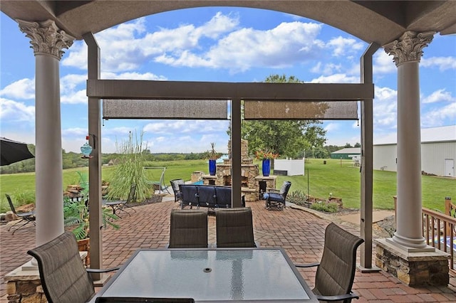 view of patio featuring a fireplace