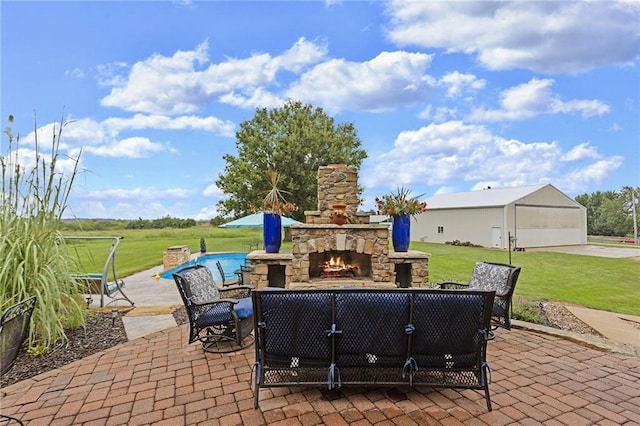 view of patio featuring an outdoor stone fireplace