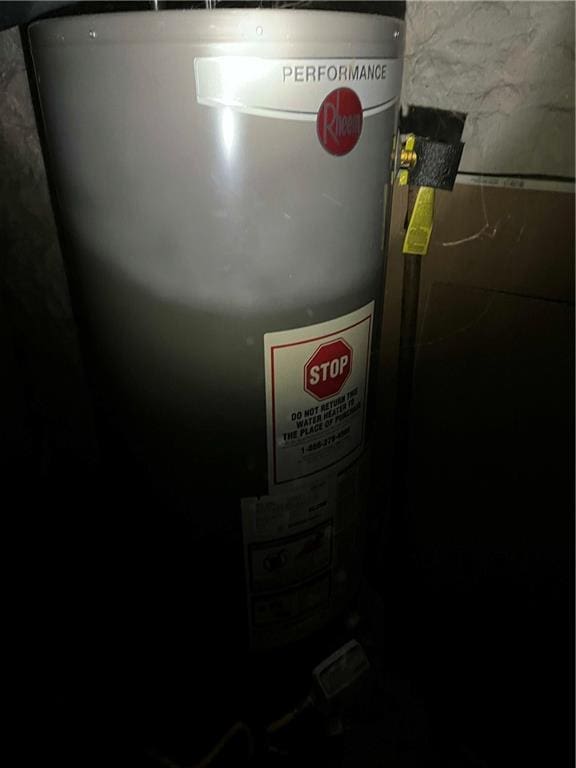 utility room featuring water heater