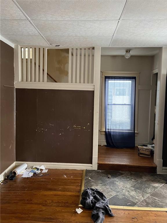 interior space featuring baseboards and wood finished floors